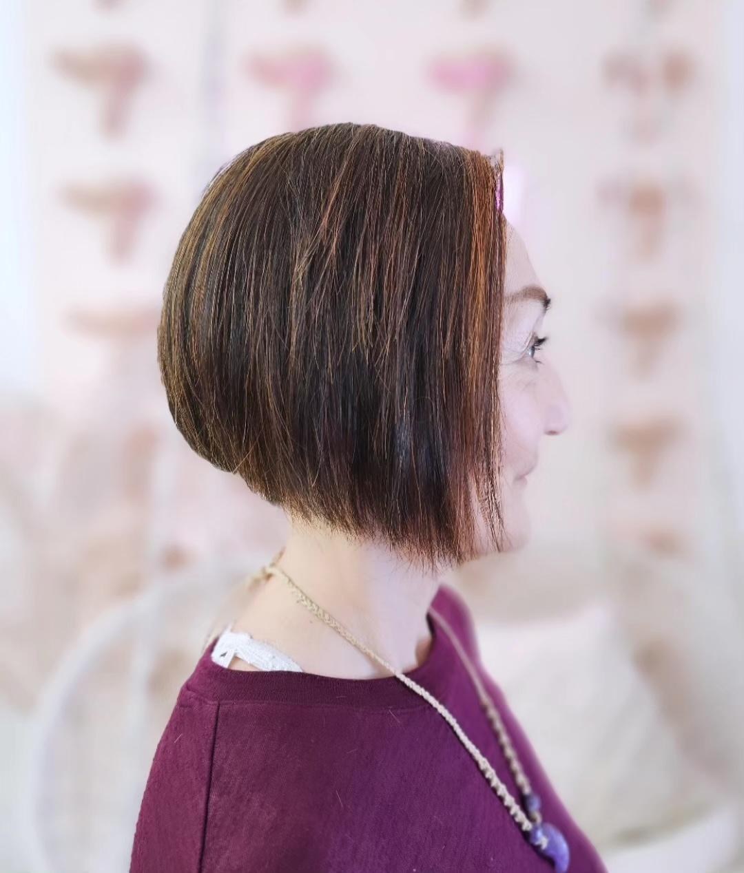 Precision chin-length brunette bob haircut by Mimi